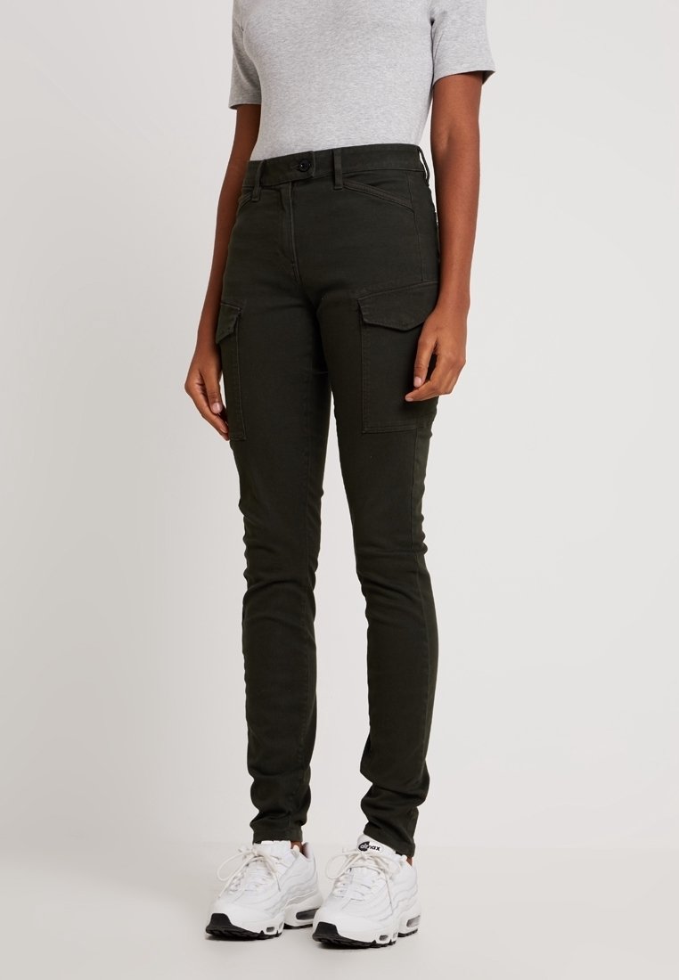 Dark green cargo pants with a slim fit, high waist, and two front pockets. Fabric appears sturdy, with a smooth texture and minimal stitching details.