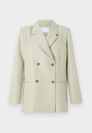 Švarkas su dvigubu užtrauktuku šviesiai žaliai medžiagai. Savybės: įpjovos apykaklės, krūtinės kišenė ir dvi priekinės kišenės su tamsiais mygtukais.