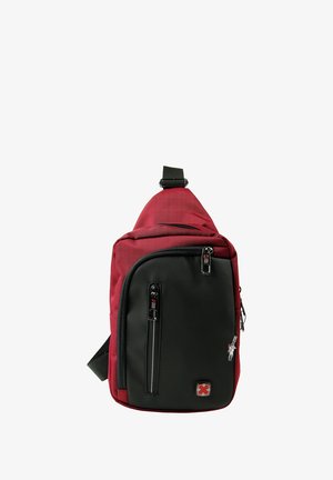 Rode en zwarte schoudertas gemaakt van nylon. Bevat meerdere ritscompartimenten, een verstelbare schouderband en een logo-patch op de voorkant. Textuurstof.