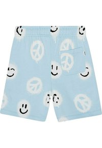 Modré bavlněné šortky s elastickým pasem, zdobené vzory černé usmívající se tváře a symbolu míru, s jednou zadní kapsou. Hladká textura.