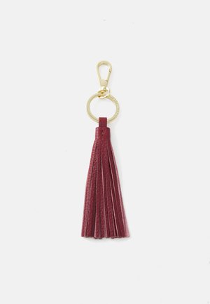 Burgundy leather keychain with a fringe tassel design. Features a gold metal clasp and keyring for attachment. Smooth texture.