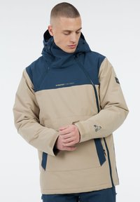 Beige- und marineblaue Kapuzenjacke mit Reißverschlussfront, verstellbaren Bündchen und Logo-Akzenten. Verfügt über einen lässigen Schnitt und einen dicken, strukturierten Stoff.