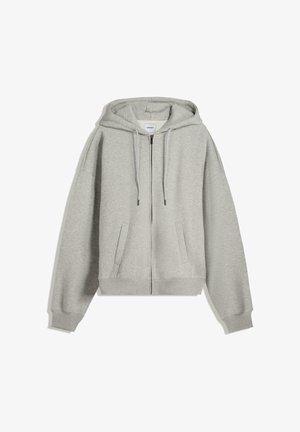 Felpa grigia con zip realizzata in un morbido mix di cotone. Caratterizzata da un grande cappuccio, cordini e tasche laterali. Vestibilità comoda con polsini a costine.
