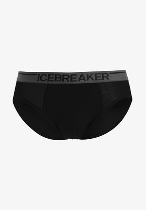 Slip negros confeccionados con un material suave y una cinturilla elástica gris donde se exhibe de manera destacada el nombre de la marca "ICEBREAKER".