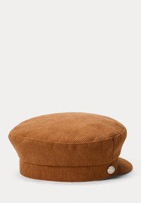 Cappello berretto in corduroy marrone, di forma rotonda, con superficie testurizzata e un accento in argento su un lato.