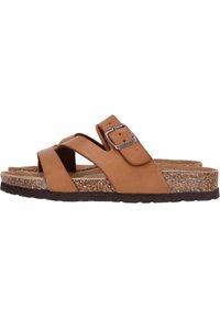 Sandales en cuir brun avec des sangles croisées, une boucle réglable et une semelle en liège. Semelle texturée et profil plat pour le confort.