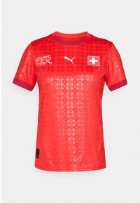 Red short-sleeve sports jersey featuring a textured pattern, Puma logo, Swiss flag emblem, and contrasting red collar and cuffs.