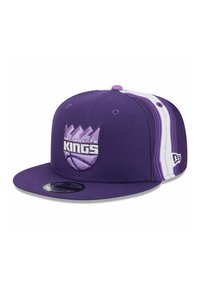 Purple snapback cap with embroidered "Sacramento Kings" logo, featuring a flat brim and striped accents in lighter purple and white.