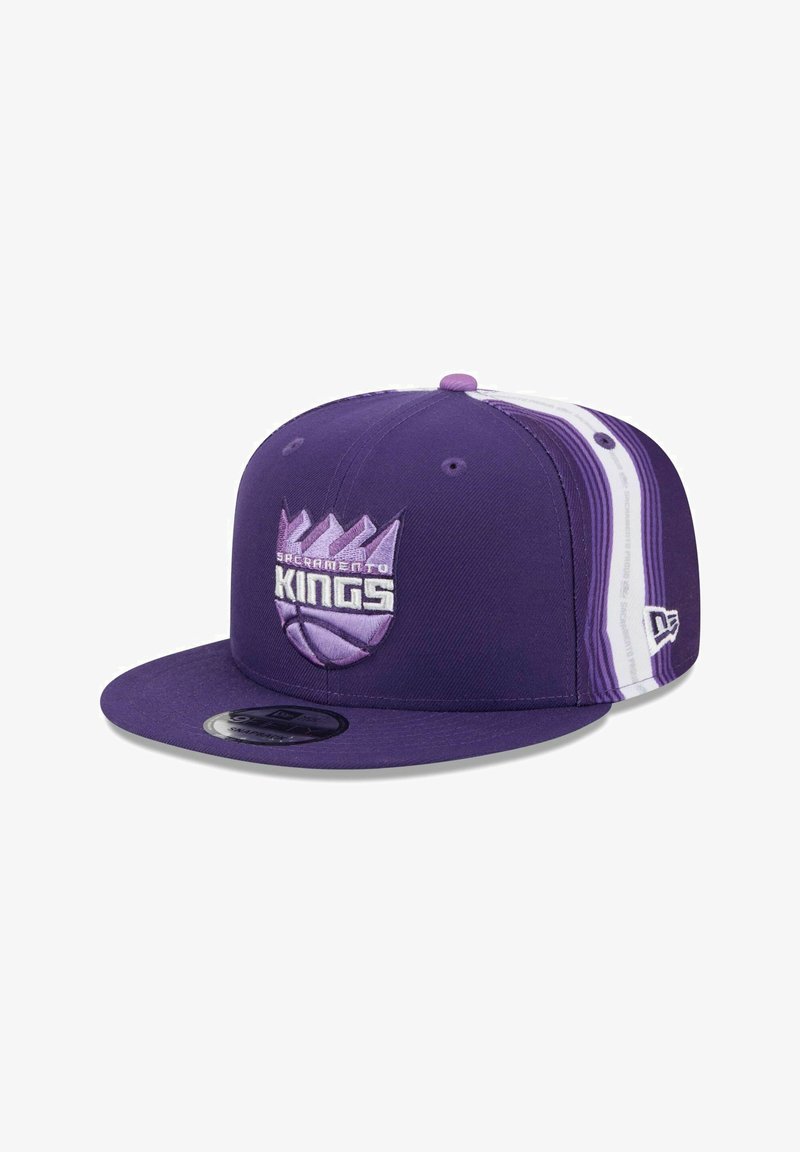 Purple snapback cap with embroidered "Sacramento Kings" logo, featuring a flat brim and striped accents in lighter purple and white.