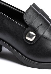 Black leather shoe featuring a flat design, rounded toe, and a metallic square accent on the strap. Smooth texture with minimal stitching.
