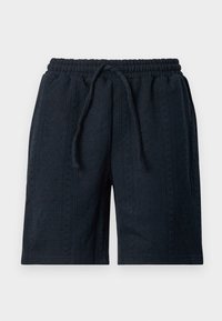 Mörkblå shorts gjorda av textil med struktur, med elastisk midja och dragsko. Har ett subtilt mönster överallt.