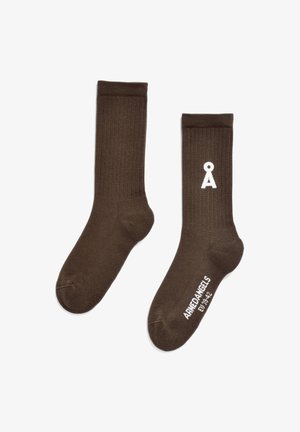 Brown ribbed socks featuring a white logo and text on the ankle, crafted from a soft fabric for comfort and durability.