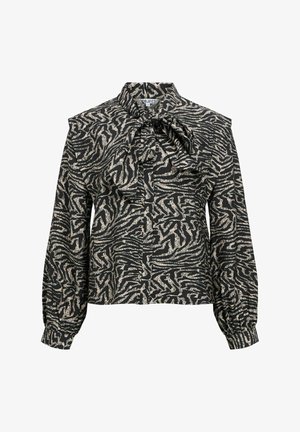 Musta pusero, jossa kultainen seepra-kuvio, korkea pääntie, kauluksessa röyhelöyksityiskohta ja pitkät ilmapallo-hiha. Kankaan pinta on teksturoitu.