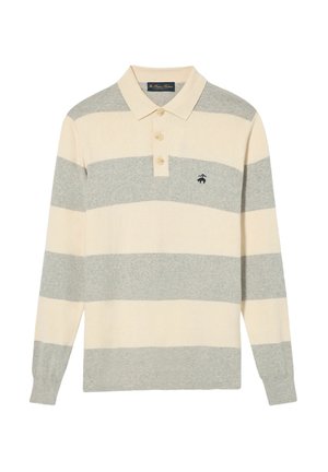 Langarm poloshirt met een crèmekleurig en lichtgrijs gestreept patroon. Heeft een kraag, drie knopen en een klein logo op de borst.