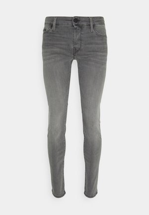 Grijze denim skinny jeans met een middelhoge taille, voorzakken en een gladde textuur. Beschikt over een knoopsluiting en subtiele vervaging.