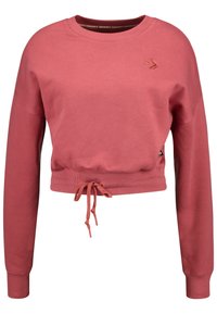 Sweat-shirt court rose en tissu doux, avec manches longues, col rond et ourlet à cordon de serrage avec poignets côtelés. Petit logo en détail.