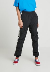 Urban Classics - LADIES STRIPED CRINKLE PANTS - Tracksuit bottoms - black/white Thumbnail Image 1