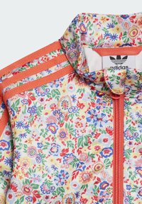 Floral-patterned Adidas jacket featuring a white base with colorful flowers, orange accents, a zip closure, and ribbed collar.