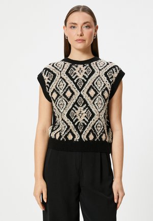 Top negro de punto sin mangas con patrones geométricos texturizados en crema y beige, con cuello y dobladillo acanalados, que presenta un diseño intrincado.