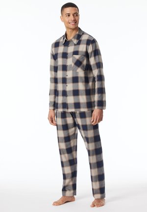 Karierte Flanelle-Pyjama-Set in Marineblau, Beige und Grau. Das Hemd verfügt über Knöpfe und eine Brusttasche, während die Hose einen elastischen Bund hat.
