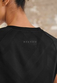 Next T-Shirt print - black
