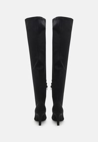 Black over-the-knee boots made of a smooth material with a fitted silhouette, pointed toe, and a stiletto heel. Features a zipper on the side.