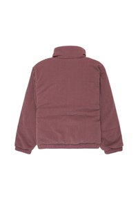 Puffer jacket in muted mauve corduroy, featuring a high collar, ribbed texture, and a relaxed fit with concealed seams and no visible fastenings.