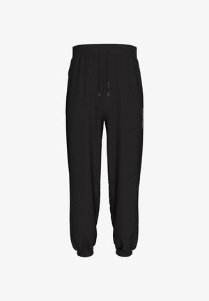 Černé fleecové tepláky s elastickým pasem, šňůrkou, bočními kapsami, elastickými manžetami a malým logem na pravém stehně.