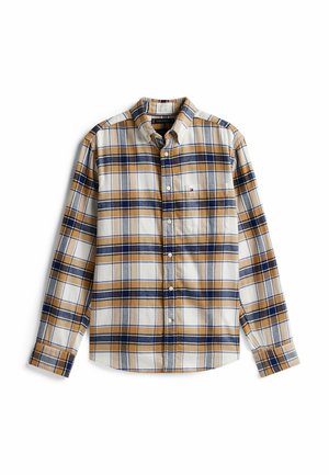 Chemise à boutons avec un motif à carreaux beige, bleu et jaune. Fabriquée en tissu à texture douce. Comprend une poche poitrine.