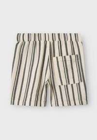 Stribede shorts i beige og sort, med en elastisk talje og en enkelt lomme på højre side. Struktureret stof.