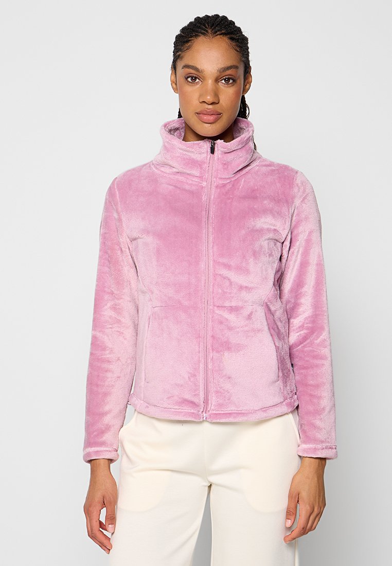 Jasnoróżowa, miękka, pluszowa kurtka z wysokim kołnierzem i zamek błyskawiczny z przodu. Posiada dwie boczne kieszenie oraz długie rękawy z mankietami.