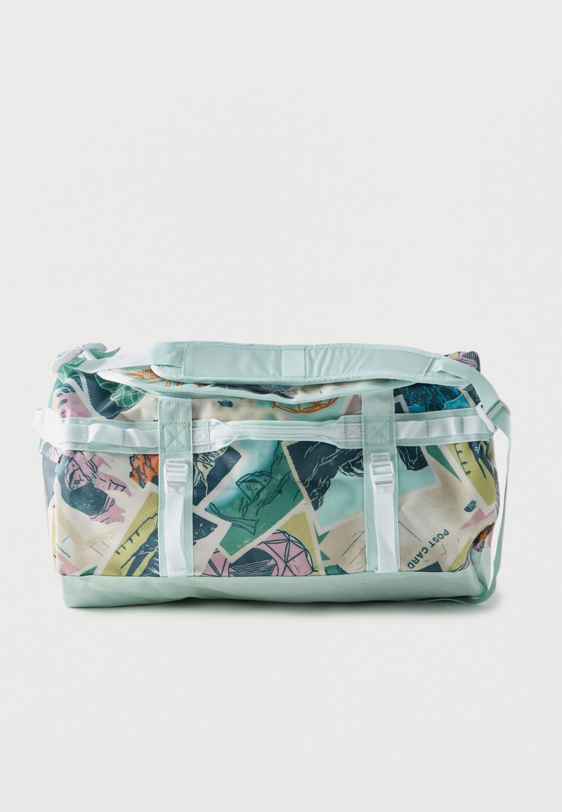 Τσάντα duffle με λουριά και κάτω μέρος σε παστέλ μέντα πράσινο, με πολύχρωμο αφηρημένο σχέδιο που θυμίζει καρτ ποστάλ και σχέδια.