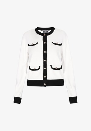 Fehér kardigán fekete szegéllyel a galléron, ujjvégeken, szegélyen, gombos előtétrészen és négy patentos zseben, mindegyik arany színű gombbal rögzítve.