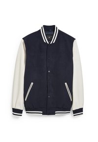 Mörkblå varsityjacka med vita ärmar, randig krage, manschetter och nederkant, snäpplås framtill och vinklade fickor.