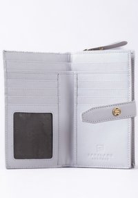 Light gray leather wallet with multiple card slots, a transparent ID window, and a snap closure. Features gold-tone hardware and embossed logo.