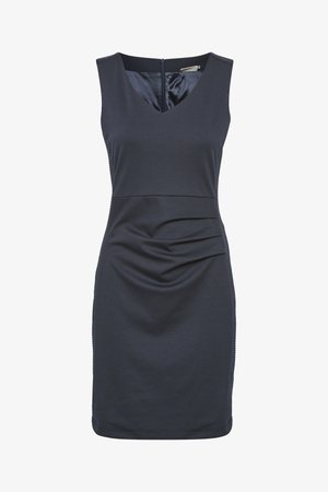 Tumši zils bez piedurknēm, ar V veida kakla izgriezumu un drapēšanas detaļām priekšā, izgatavots no gludas auduma, ar aizmugurējo rāvējslēdzēja aizdari.