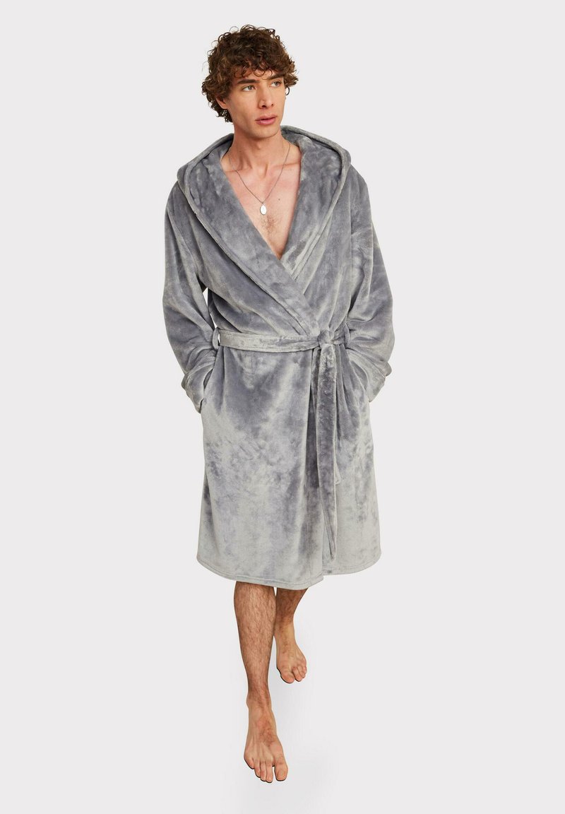 Gray plush bathrobe with a hood, tie belt, and two front pockets. Soft texture, knee-length design, and a slightly faded pattern throughout.