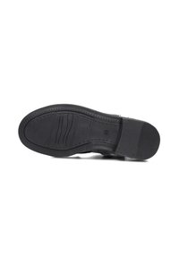 Black rubber shoe sole with grooves and ridges; features a smooth textured surface and slight taper towards the toe for improved grip.