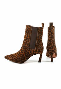 Leopard print ankle boots in brown and black suede with pointed toes, a short block heel, and elastic side panels for easy wear.