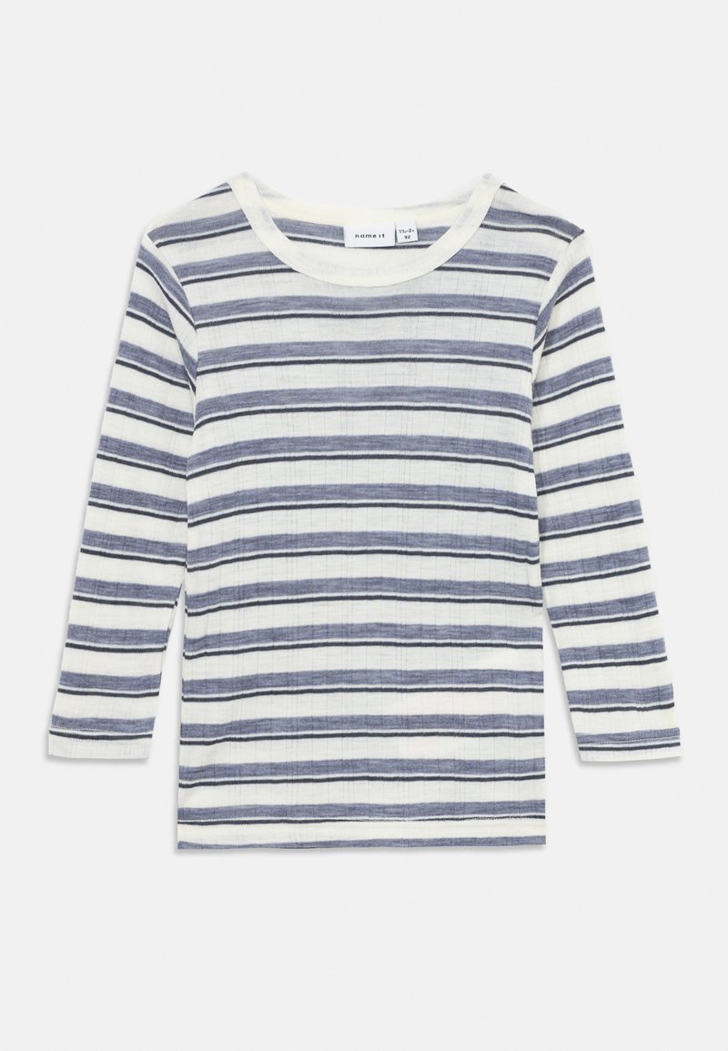 Camisola de manga longa às riscas em branco e azul marinho, com riscas horizontais. Feita de um material texturizado, possui um decote redondo e ajuste padrão.