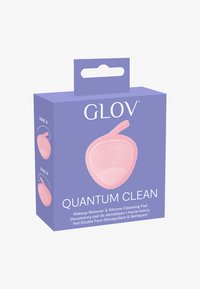 Różowa silikonowa podkładka do oczyszczania zapakowana w fioletowe pudełko, z napisem "GLOV QUANTUM CLEAN" oraz etykietami na bokach dotyczących użycia.