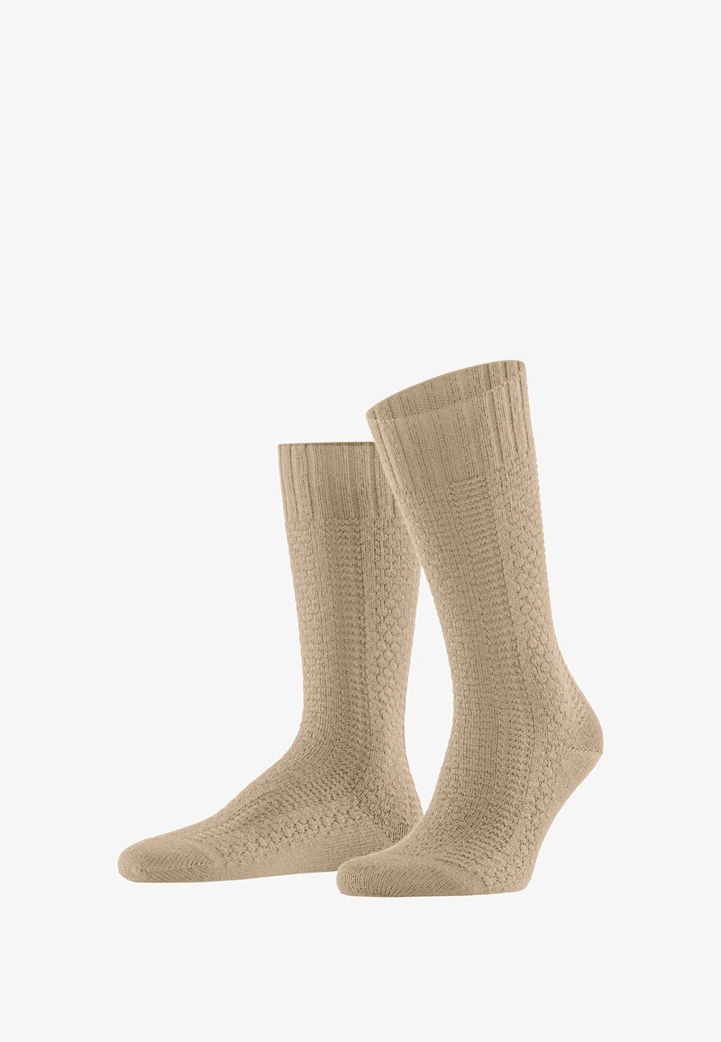 Calzini di cotone beige con un design testurizzato a coste e un motivo a nido d'ape sul gambale, con tallone e punta rinforzati.