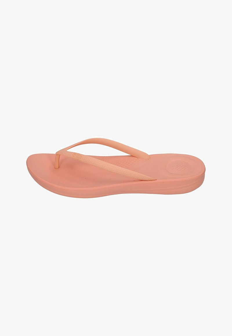 Pfirsichfarbene Flip-Flops mit einer strukturierten Fußbett, flexiblen Riemen und einer glatten Sohle. Leichtes Design für den Freizeitgebrauch.
