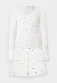 Λευκή σετ με μακρυμάνικη μπλούζα ριμπ και σορτς με μικρό μπλε λουλουδένιο σχέδιο και κυματιστές άκρες στις μανσέτες, το στρίφωμα και το ντεκολτέ.