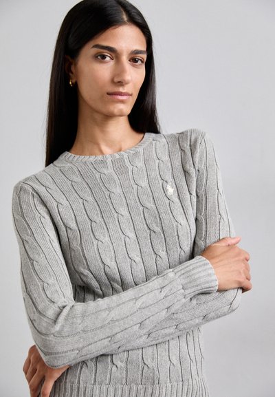Gray knitted sweater with cable pattern, round neckline, and long sleeves. Features ribbed cuffs and hem. Subtle logo accent on chest.