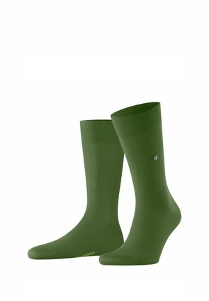 Dunkelgrüne Socken mit einem gerippten Bund, aus einem glatten Material gefertigt. Sie verfügen über ein Logo an der Seite und ein solides, nahtloses Design.