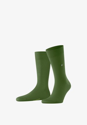 Dunkelgrüne Socken mit einem gerippten Bund, aus einem glatten Material gefertigt. Sie verfügen über ein Logo an der Seite und ein solides, nahtloses Design.