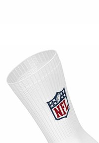 Valkoinen urheilusukka, jossa on ribboitu pinta ja sinivalkoinen sekä punainen brodeerattu NFL-logo säären alueella.