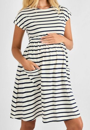 Gestreepte jurk in crème en marineblauw, korte mouwen, getailleerde taille, wijde rok, voorzien van zijzakken, gemaakt van zachte, lichte stof.