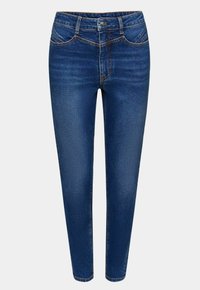 Jeans de mezclilla azul oscuro con una silueta ajustada, cintura de talle medio, diseño estándar de cinco bolsillos y detalles sutiles de costura.